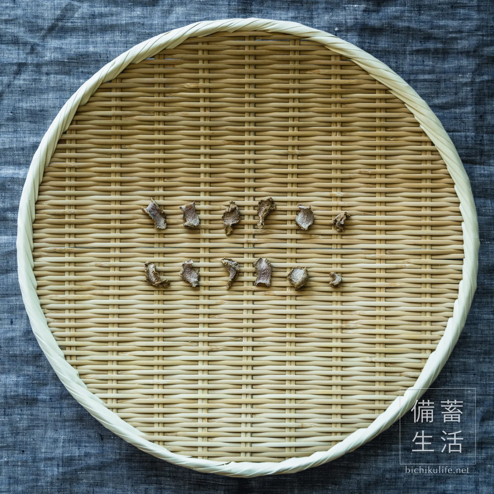 Thinly sliced dried ginger on a bamboo basket