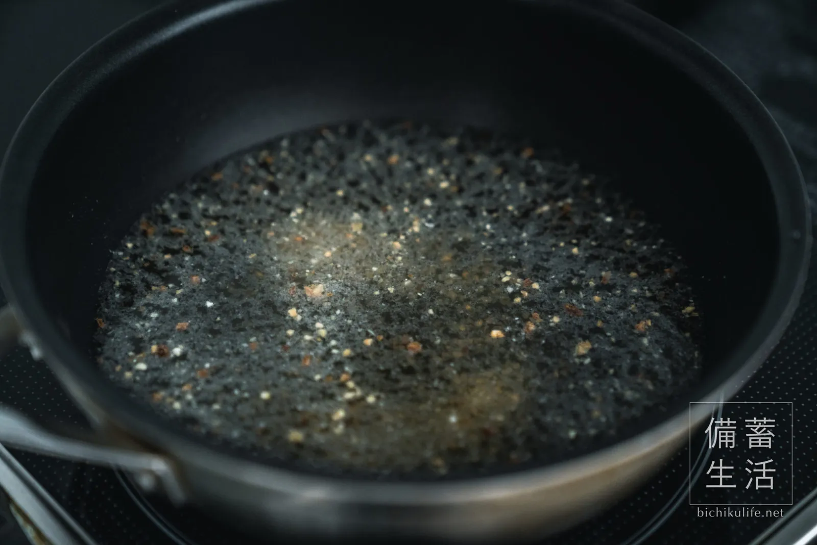 Onions in a pot with stock and water