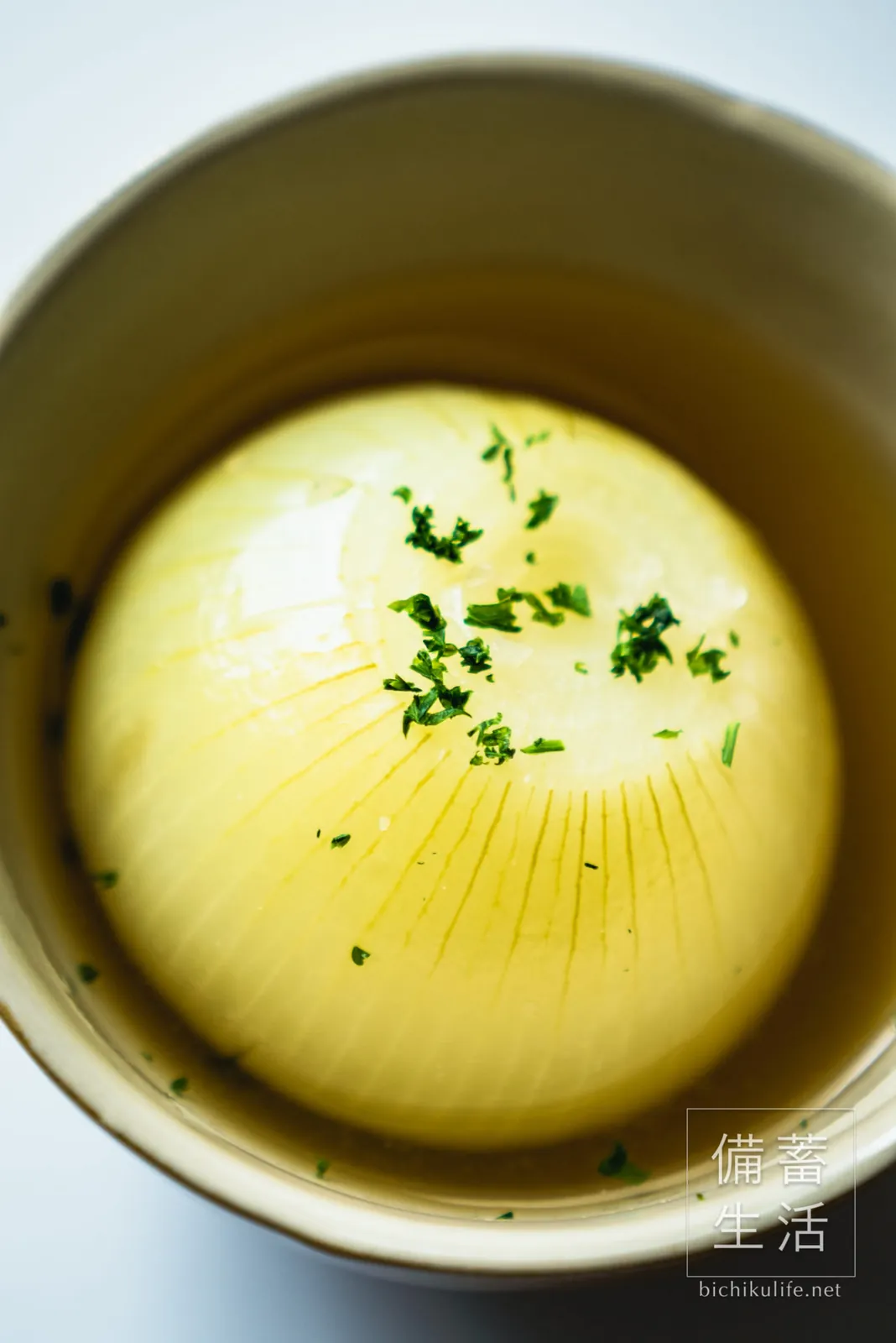 Whole onion soup garnished with parsley