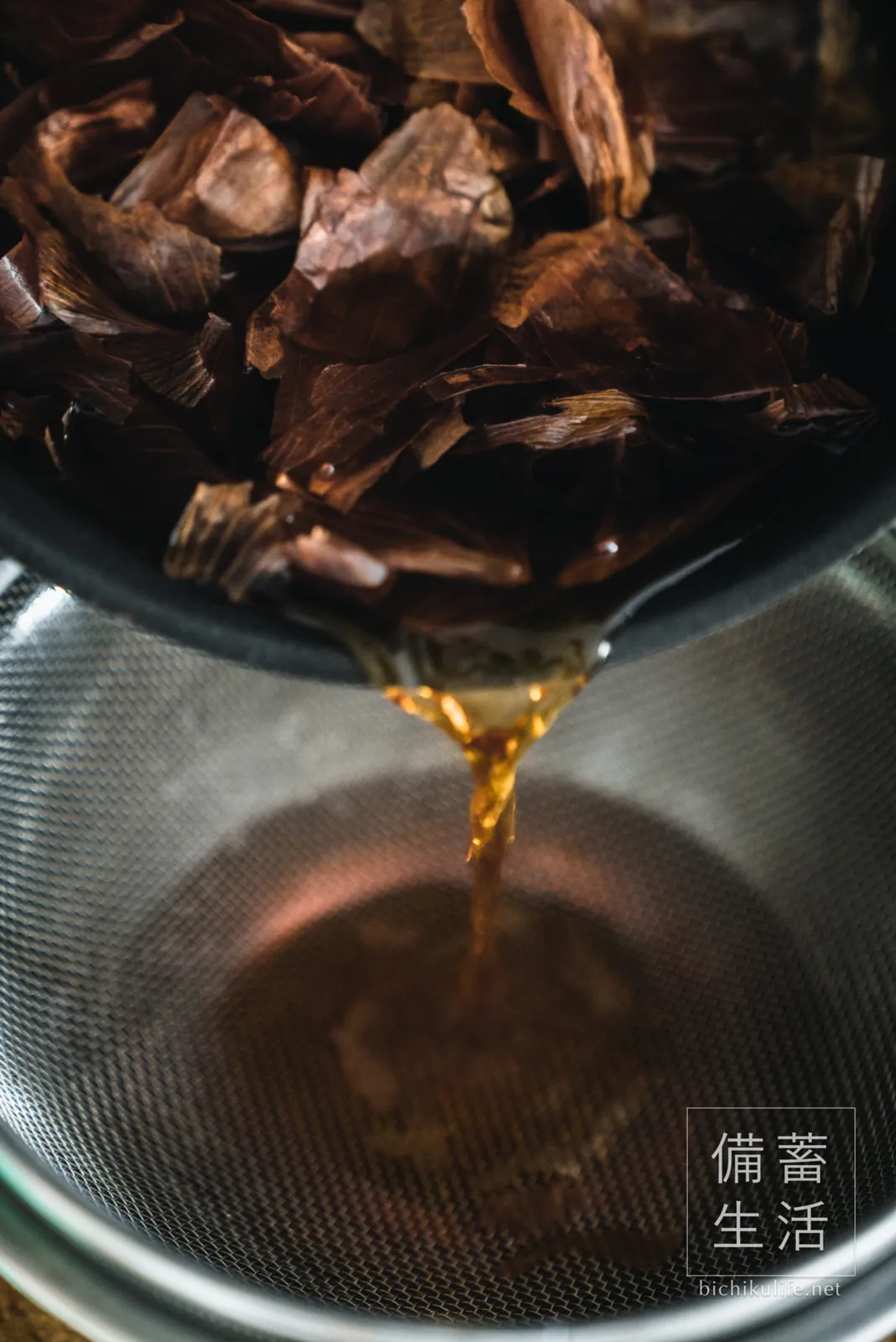 Straining the onion skin tea